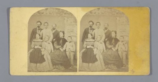 Portrait of a family in front of a wall
