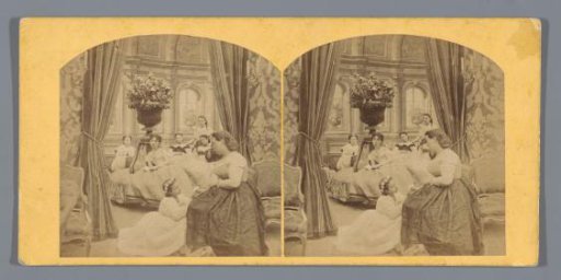 Woman on a chair with a girl kneeling beside her and five women behind her