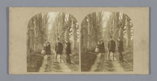 Two men and women on a path in a forest