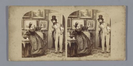 Man with a tall hat and a woman in a room with paintings