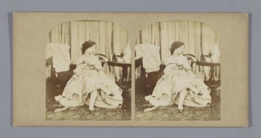 Portrait of an unknown seated woman holding her foot