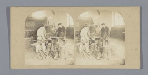 Four smiths at work in a workshop