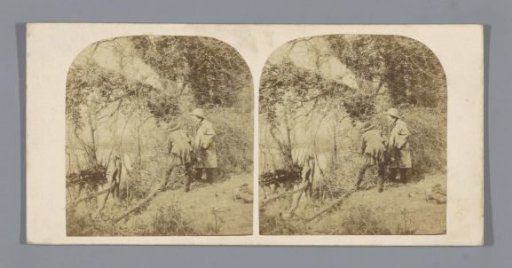 Two men at the water's edge in a wood
