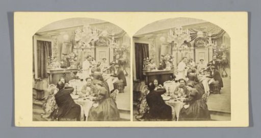Interior of a restaurant with tables, people, a waiter and a violinist