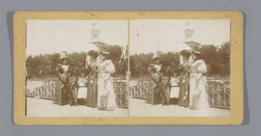 Four women with a child in a park