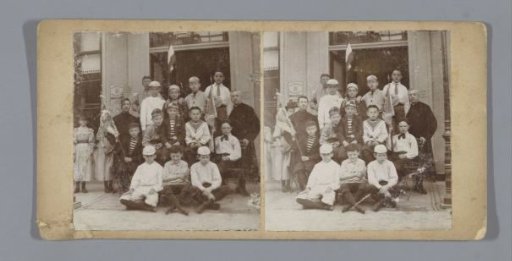 Portrait of a group of unknown boys in scout costume with a pastor and presumably a chaplain