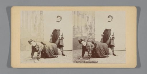 Two women playing wheelbarrow