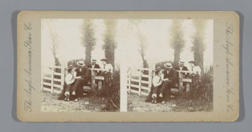 Two couples at a fence in the woods