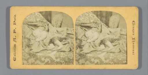 Sleeping baby on a divan