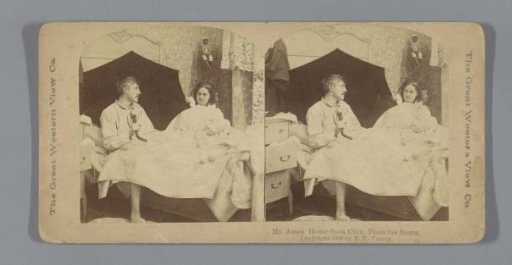 Married couple in bed with an umbrella