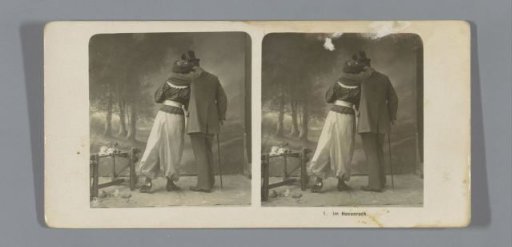 Couple seen from behind, the woman wearing trousers
