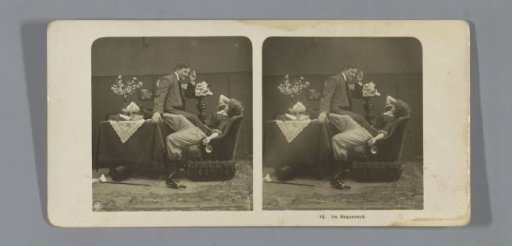 Woman in trousers lying sprawled in a chair with an empty wine bottle on the floor