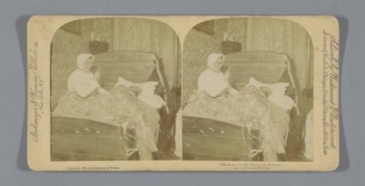 Woman with raised finger sitting in bed next to a lying man