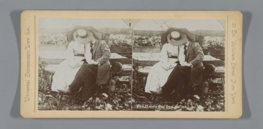 Couple concealed behind hat and umbrella