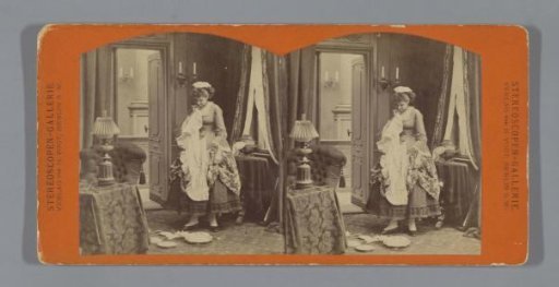 Young woman in living room with broken crockery on the floor