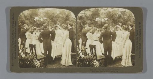 Group of people raising a glass to the bride and groom