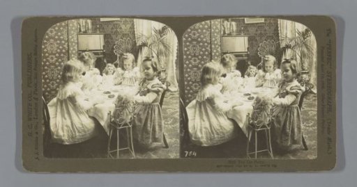 Children playing with toy tea set