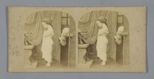 Sculpture of a woman in a nightshirt with a sculpture of a man looking on from a doorway
