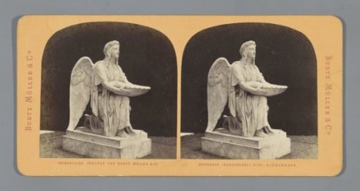 Sculpture of an angel with a Saint James shell