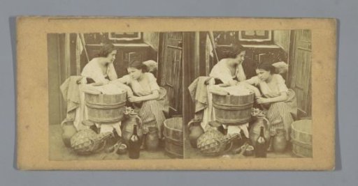 Two women beside a wash tub