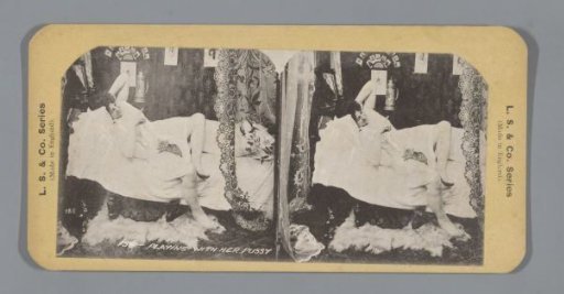 Woman on a bed with a cat
