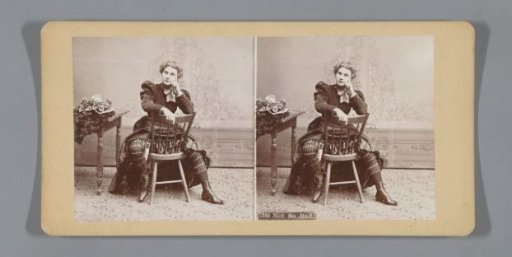 Woman posing seated backwards on a chair