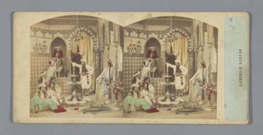 Oriental scene with a group of people around a fountain