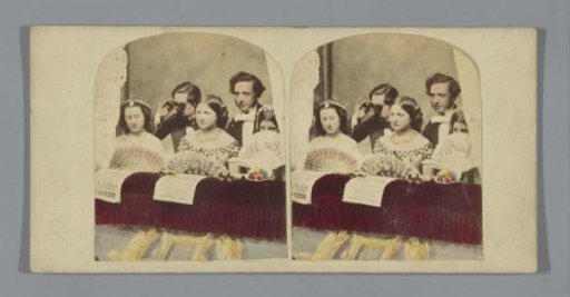 Scene in a theatre: three women and two men in a box