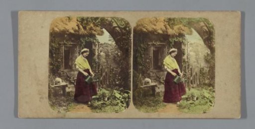 Woman Watering Plants in Front of a Cottage