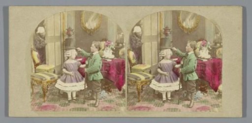 Two children playing with grandfather's wig