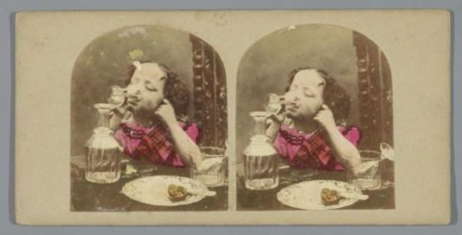 Child at a Table Drinking from a Glass