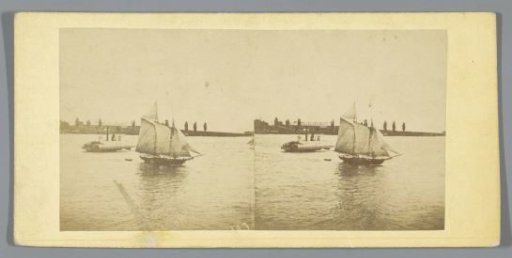 Sailing ship and ferry in a canal