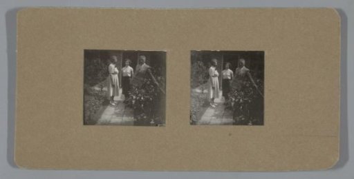 Man and two women in a garden