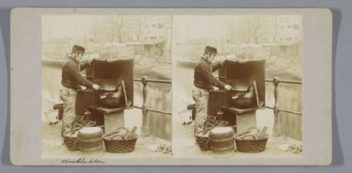 Man frying fish at the Nieuwegrachtje, Amsterdam