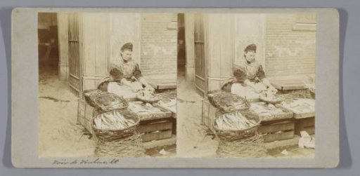 Woman cleaning fish for the fish market on the Nieuwmarkt, Amsterdam