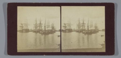 Sailing ships in a harbour, probably Amsterdam
