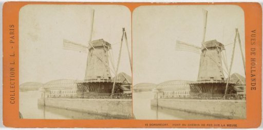 View of a mill and the railway bridge over the Old Meuse near Dordrecht