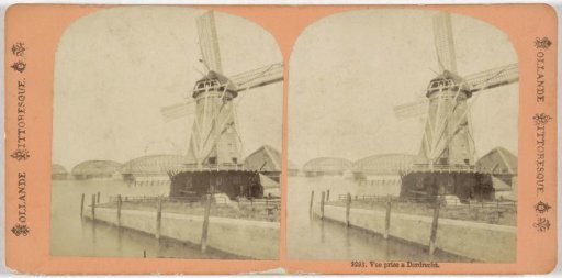 View of a mill and the railway bridge over the Oude Maas near Dordrecht