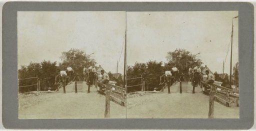View of a bridge with a few people in Monnickendam