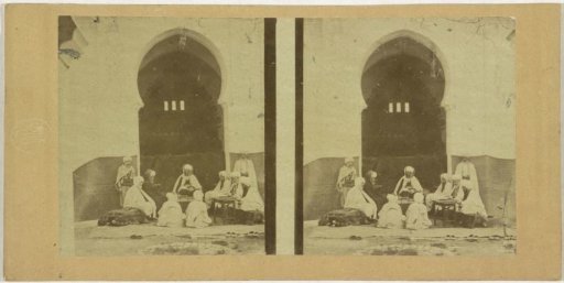 Group of men before a building, possibly a mosque, in Algiers