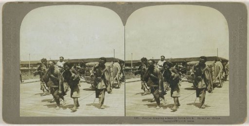 Four men pulling a heavily laden cart, Shanghai