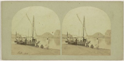 Nubian Egyptians on the bank of the Nile next to a Dahabiyeh