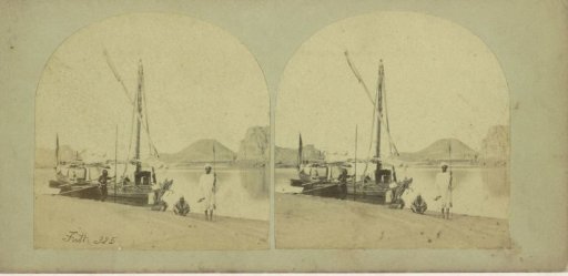 Nubian Egyptians on the bank of the Nile next to a Dahabiyeh