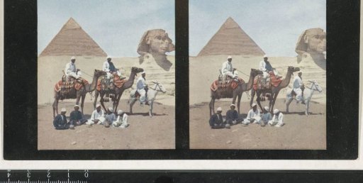 Group of men with dromedaries and a donkey near the Pyramid of Cheops and the Sphinx of Giza