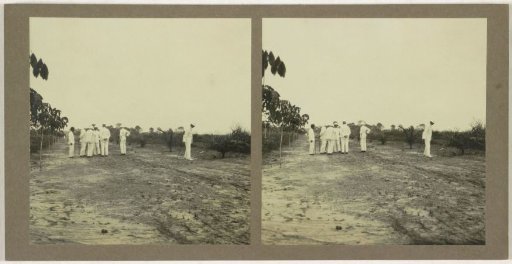 Seven men on a country road, possibly in Borneo, Indonesia