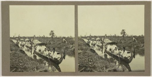 Several boats on the Sungai Martapura river, with both Europeans and indigenous inhabitants of Borneo