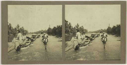 Several boats on the Sungai Martapura river, with both Europeans and indigenous inhabitants of Borneo