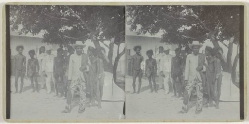 Three Europeans among some Moluccan inhabitants of Dobo.