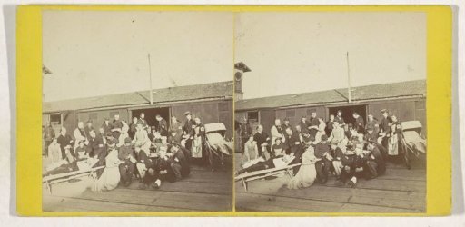 Nurses and wounded in front of a warehouse, Mexico