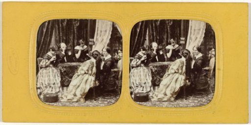 Company viewing stereoscopes at a table